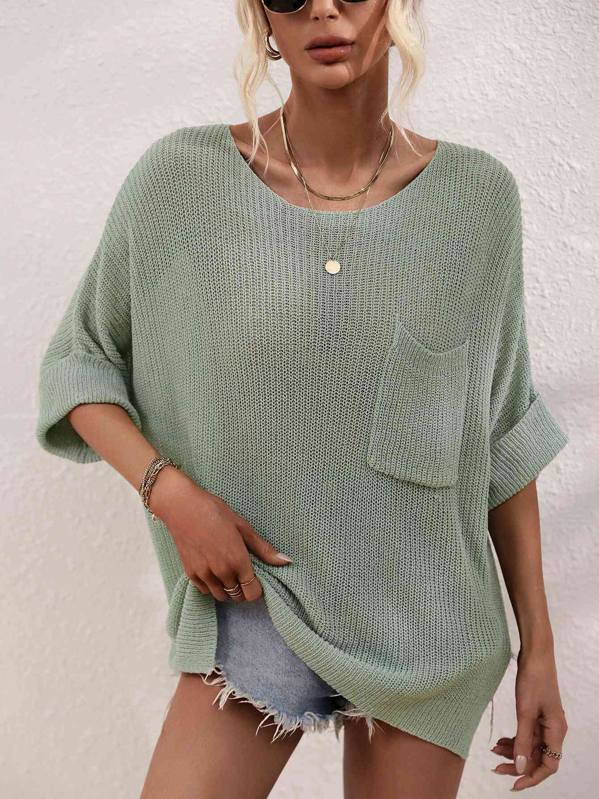 Top de punto tipo túnica con abertura y mangas con puños y cuello barco